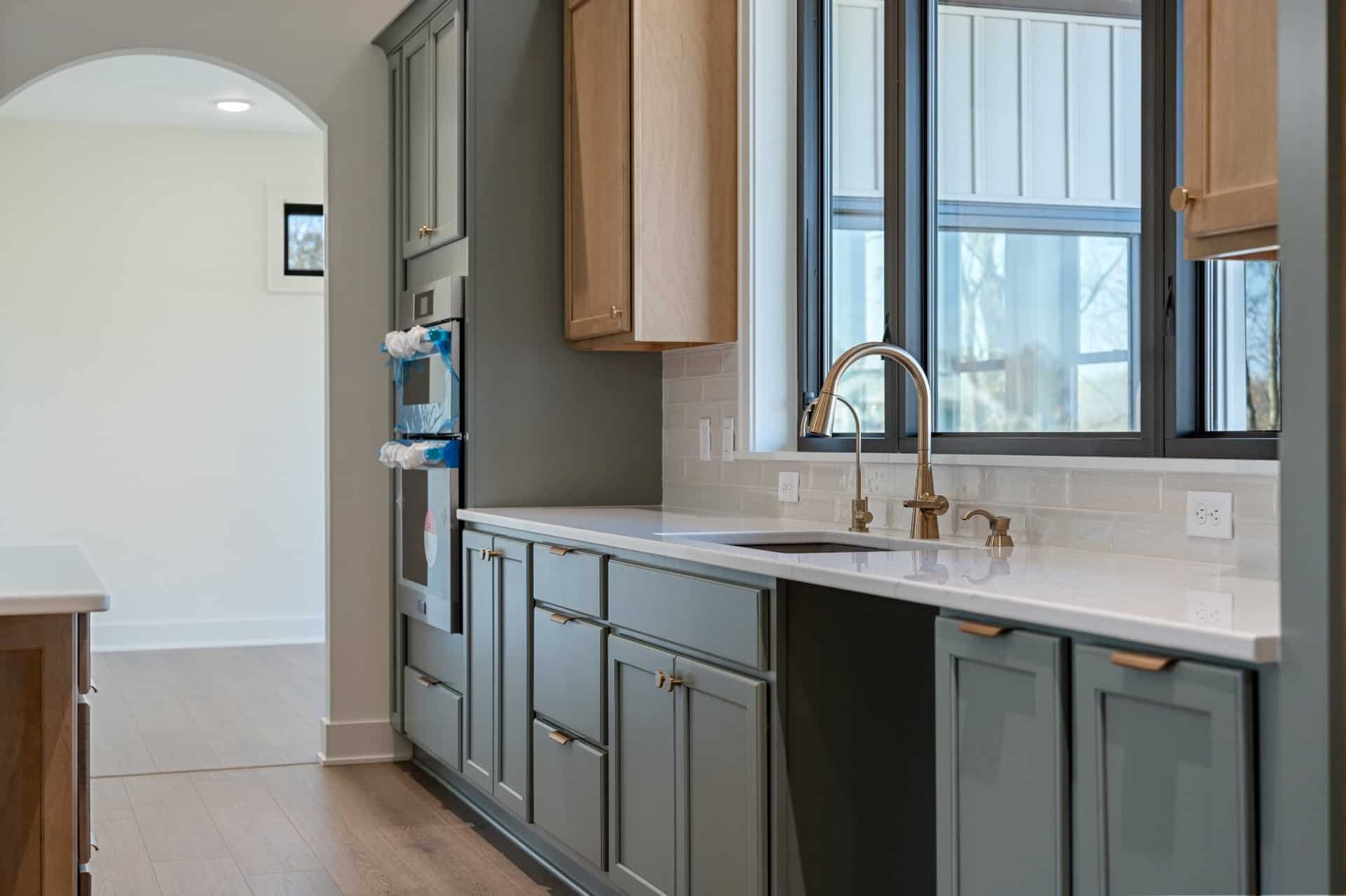 blue-green-kitchen-cabinets-bronze-hardware-jackson-township