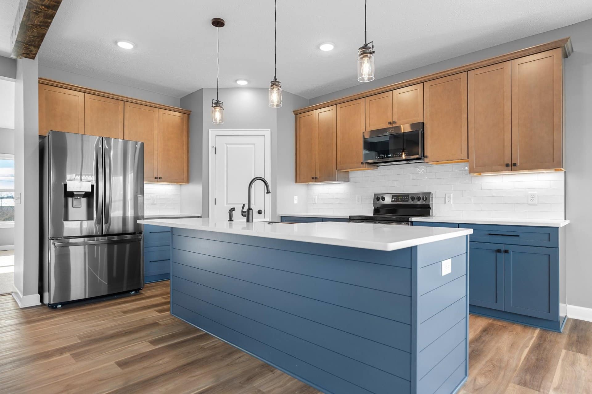 blue-shiplap-island-natural-cabinets-lake-township-builder
