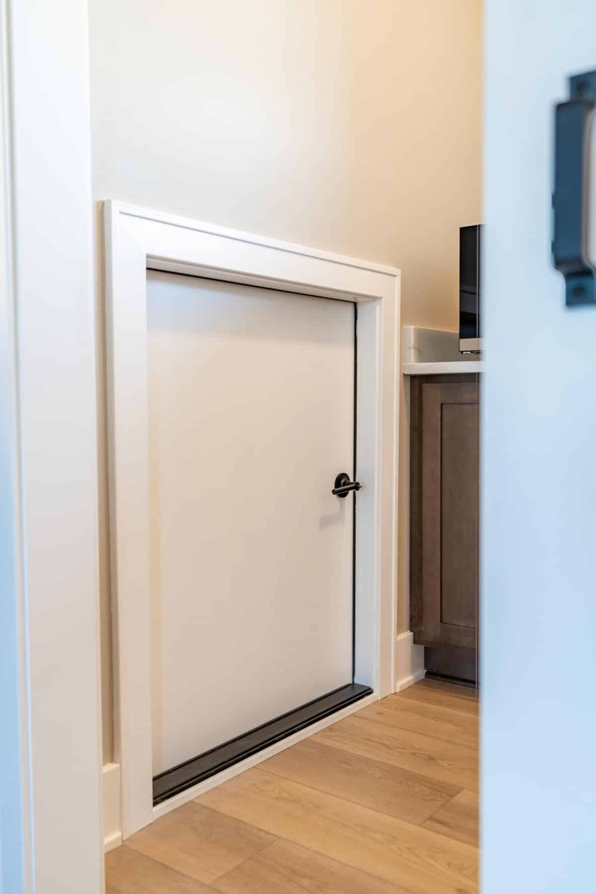 built-in-storage-cabinet-pocket-door-custom-home-plain-township-ohio