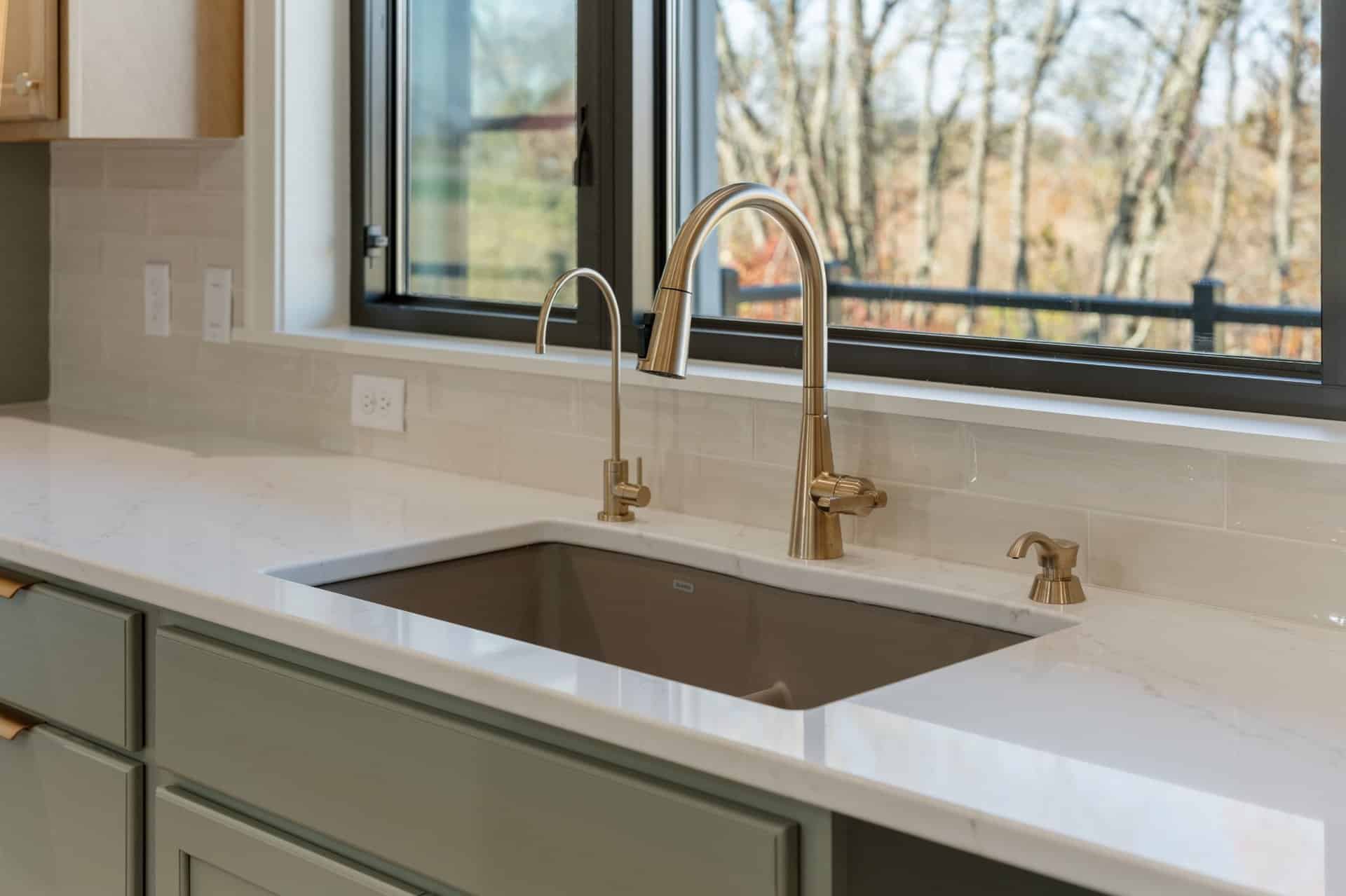 dual-faucet-kitchen-sink-brass-fixtures-stark-county-builder