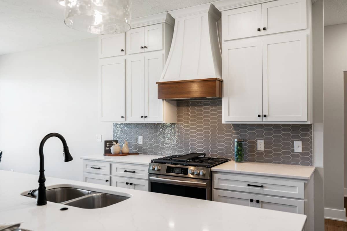 modern-kitchen-hexagon-backsplash-custom-range-hood-plain-township-builder