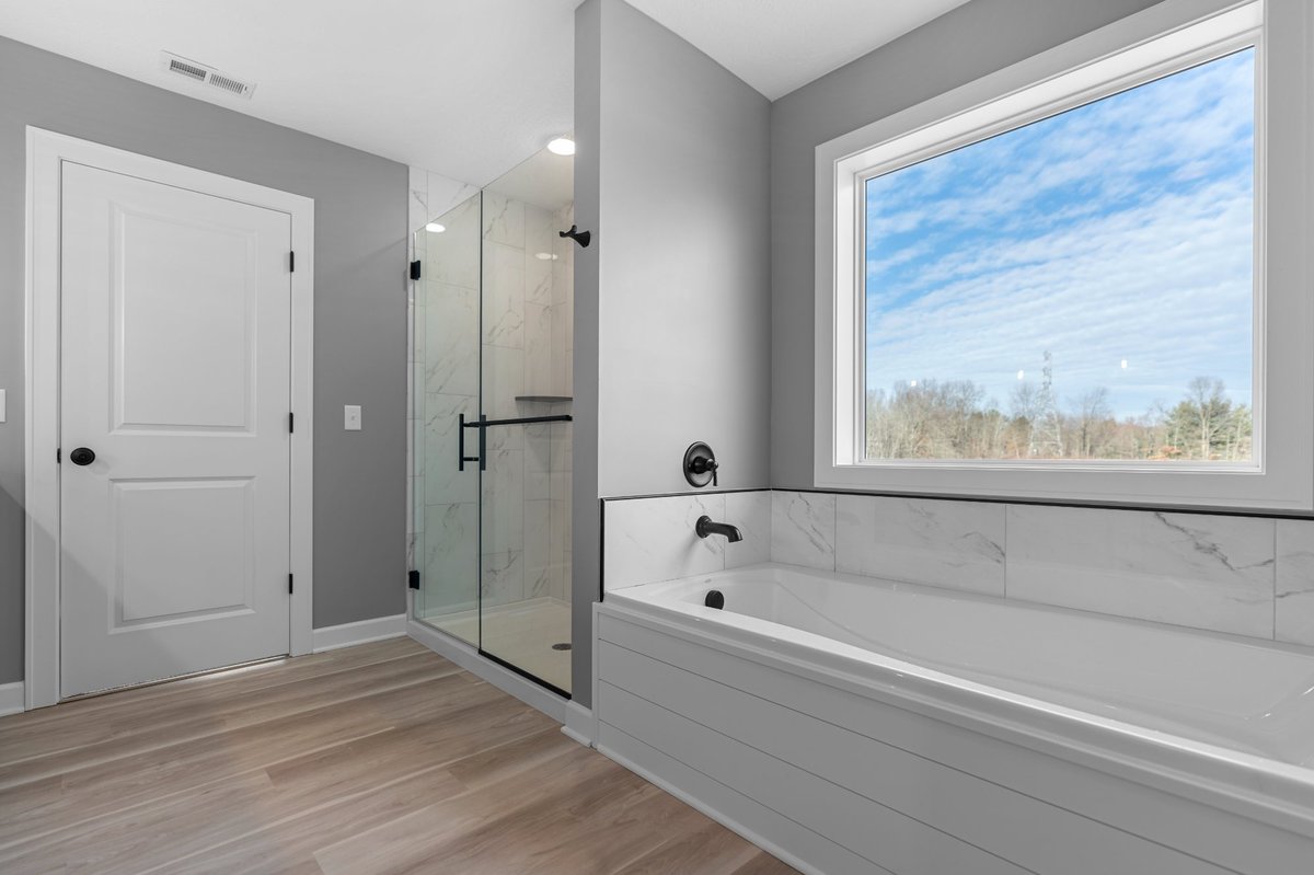 farmhouse-primary-bath-shiplap-tub-surround-gray-walls-hartville