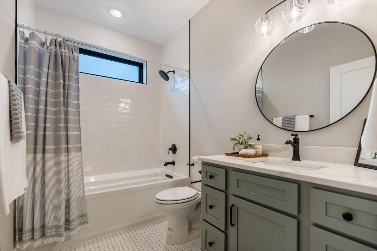 guest-bathroom-subway-tile-sage-green-vanity-jackson-township-builder